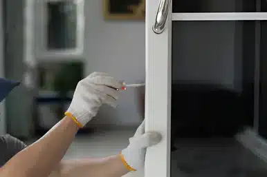 UPVC Door Locksmith Upvc door lock repairing with a screwdriver