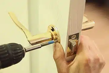 UPVC Door Handle Repair Replacement UPVC door handle being repaired with a cordless screwdriver